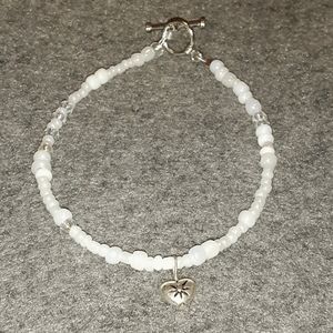 White beads with heart